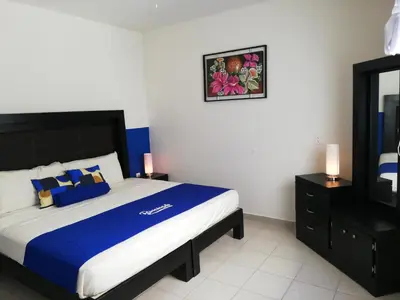 Cama o camas de una habitación en La Estancia Apartments Mazatlan