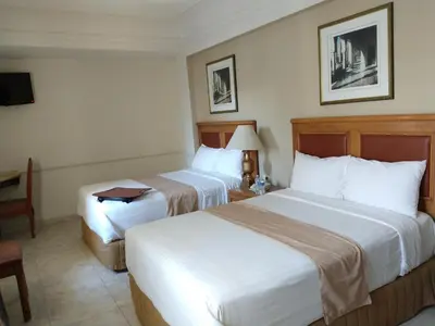 Cama o camas de una habitación en Savoy Express