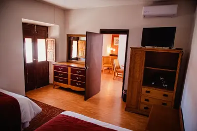 Cama o camas de una habitación en HOTEL BOUTIQUE EL VIEJO MUNDO