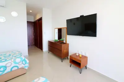 Una televisión o centro de entretenimiento en GAVIAS GRAND MAZATLAN APT. 1415