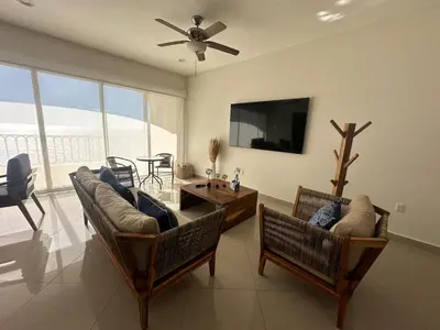 Una televisión o centro de entretenimiento en GAVIAS GRAND MAZATLAN APT. 1415