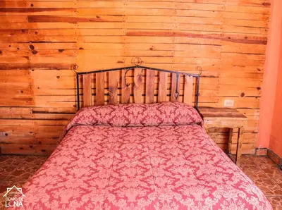 Cama o camas de una habitación en Cabañas Claro de Luna