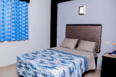 Cama o camas de una habitación en Maxihotel Business Class Culiacan