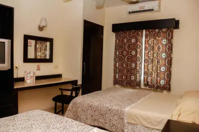 Cama o camas de una habitación en Maxihotel Business Class Culiacan