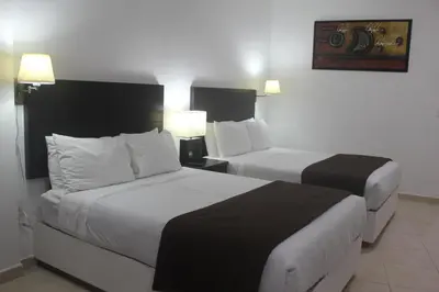 Cama o camas de una habitación en Hotel Marina Topolobampo
