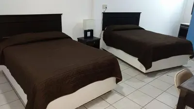 Cama o camas de una habitación en Hotel Marina Topolobampo