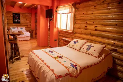 Cama o camas de una habitación en TARAMURI HOTEL & TOURS