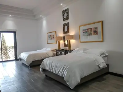 Cama o camas de una habitación en Hotel Boutique Villa Toscana