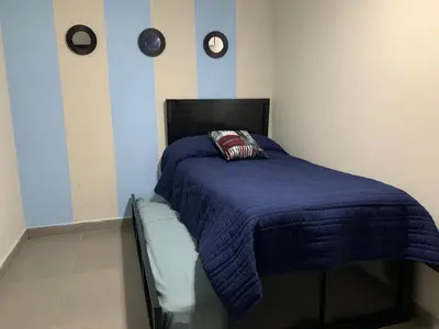 Cama o camas de una habitación en Zona dorada: amplio departamento para 12