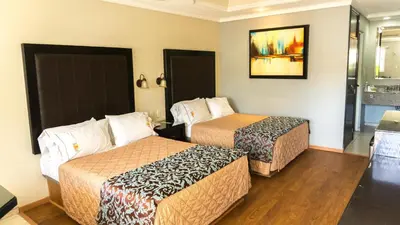 Cama o camas de una habitación en Hotel Santiago Plaza
