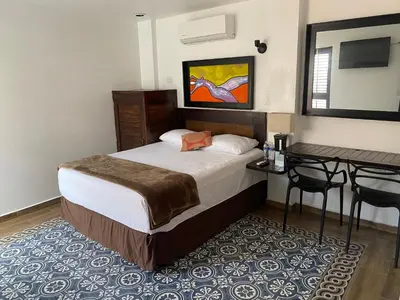 Cama o camas de una habitación en Hotel Raices de Mar