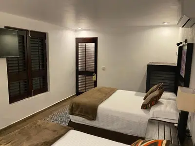 Cama o camas de una habitación en Hotel Raices de Mar