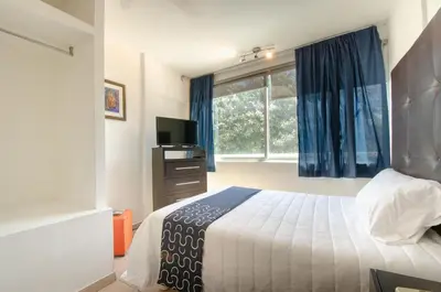 Cama o camas de una habitación en My Suite Ejecutiva