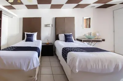 Cama o camas de una habitación en My Suite Ejecutiva