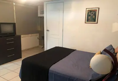 Cama o camas de una habitación en My Suite Ejecutiva