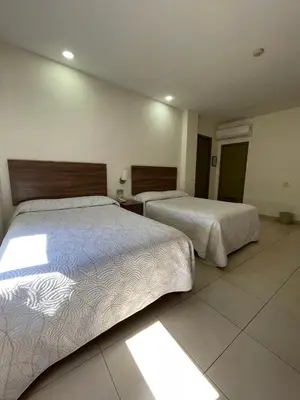 Cama o camas de una habitación en Hotel el Mayo Inn