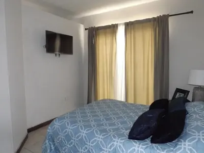 Cama o camas de una habitación en Departamento UNIVERSITARIO en fraccionamiento privado
