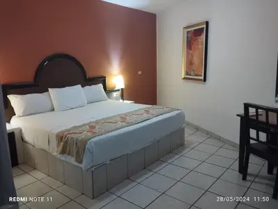 Cama o camas de una habitación en Hotel Hacienda Nainari