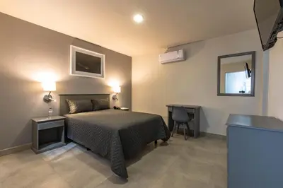 Cama o camas de una habitación en Hotel Nuve Gomez Palacio