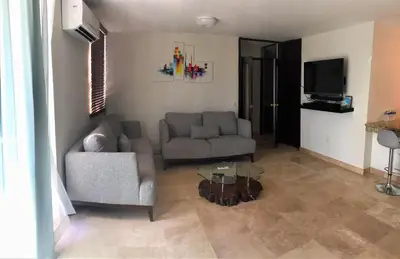 Zona de estar de Departamento comodo, a media cuadra de la playa.