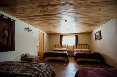 Cama o camas de una habitación en Cabaña La Victoriana