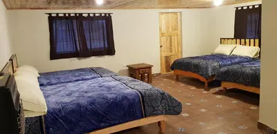 Cama o camas de una habitación en Cabaña La Victoriana