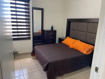 Cama o camas de una habitación en Departamento para familias