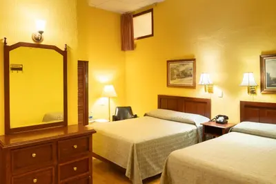 Cama o camas de una habitación en Hotel Posada San Agustin