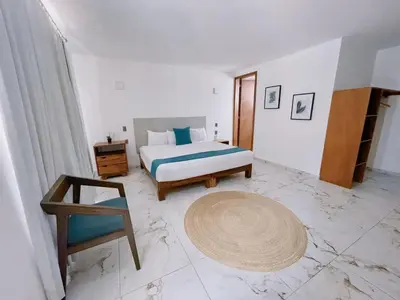 Cama o camas de una habitación en AZUL ARENA Hotel Boutique