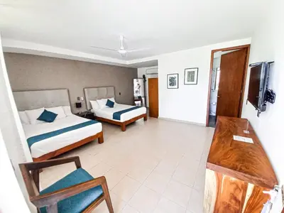 Cama o camas de una habitación en AZUL ARENA Hotel Boutique