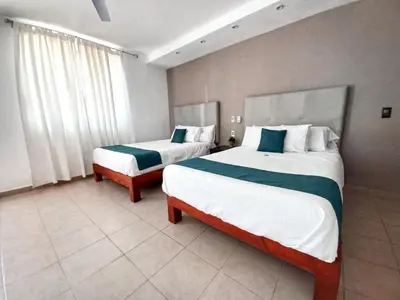 Cama o camas de una habitación en AZUL ARENA Hotel Boutique