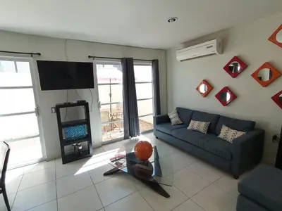 Una televisión o centro de entretenimiento en Hermosa, grande y pet friendly - 6 personas a 4 calles del Mar