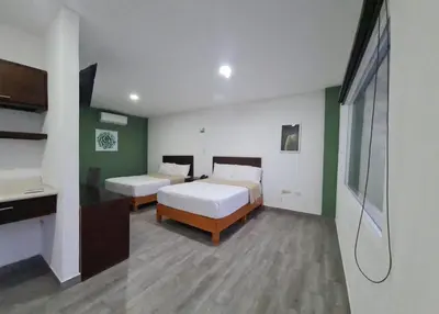 Cama o camas de una habitación en Noas Hotel