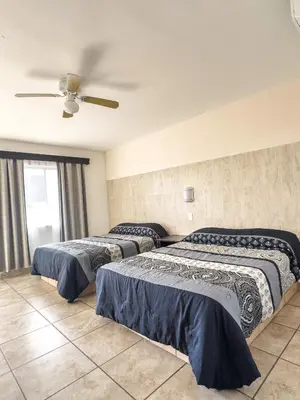 Cama o camas de una habitación en Eco Bay Hotel