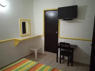 Una televisión o centro de entretenimiento en Hotel Kiko