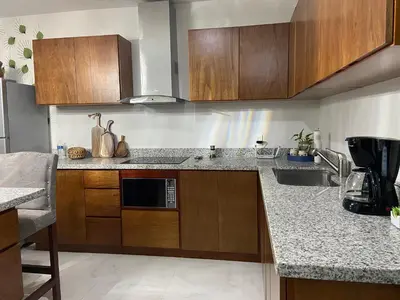 Una cocina o zona de cocina en Departamento con vista al mar