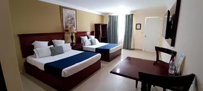 Cama o camas de una habitación en Hotel Confort Plaza