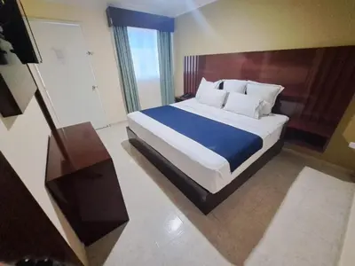 Cama o camas de una habitación en Hotel Confort Plaza