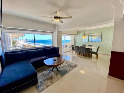 Zona de estar de FRENTE AL MAR A PIE DE PLAYA CON ALBERCA yJACUZZY