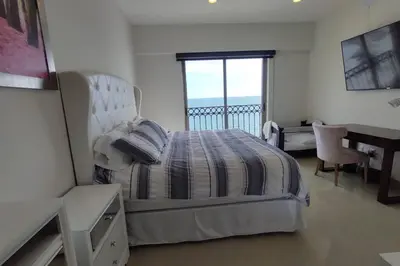 Cama o camas de una habitación en Condominio de lujo a Pie de Playa