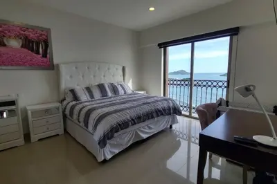 Cama o camas de una habitación en Condominio de lujo a Pie de Playa