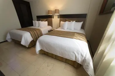 Cama o camas de una habitación en Ramada Hola Culiacan