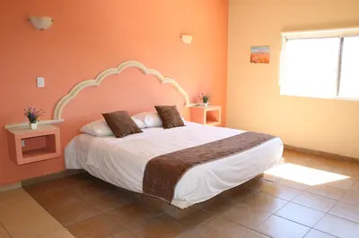 Cama o camas de una habitación en Hotel Parque Inn