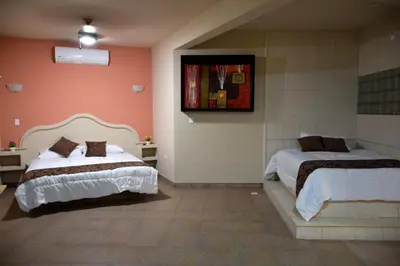 Cama o camas de una habitación en Hotel Parque Inn