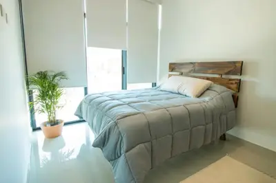 Cama o camas de una habitación en Amplio departamento Modern Boho cerca de la playa