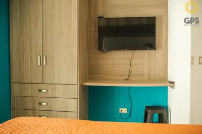 Una televisión o centro de entretenimiento en 8014 Habitación hotelera en Condominios Pacifika.