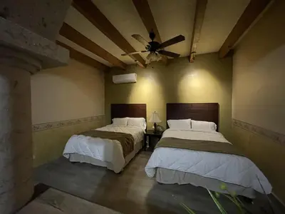 Cama o camas de una habitación en Hotel Real de los Alamos