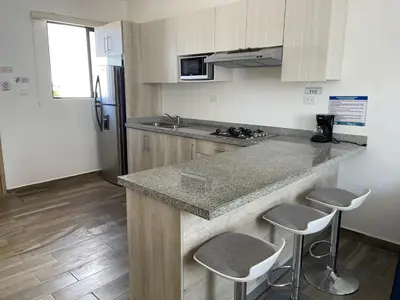 Una cocina o zona de cocina en Depto. totalmente nuevo y amueblado