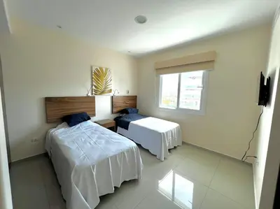 Cama o camas de una habitación en Pacifika 7007 con vista panorámica a la marina