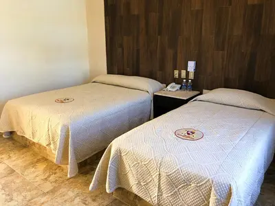 Cama o camas de una habitación en Hotel Conquistador
